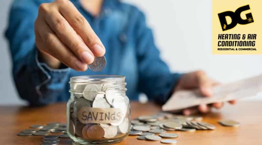 person with money in jar